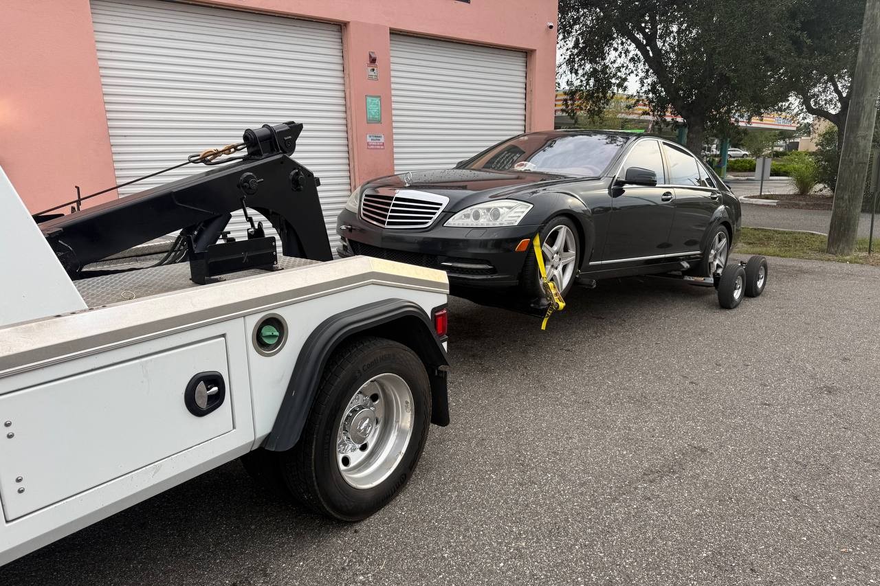 Tow truck receipt and a flatbed in Tampa — Hillsborough County maximum towing rates 2026